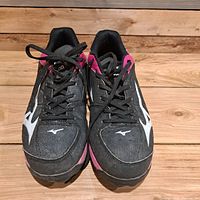 Top view of both Mizuno cleats showing laces, logos and overall wear