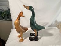 Front view of both carved wooden ducks