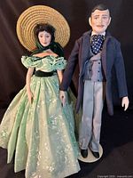 Full view of both dolls standing side by side