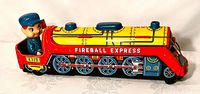 Left side view of locomotive showing Fireball Express graphics and engineer figure