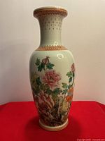 Full front view of vase showing floral and bird motif