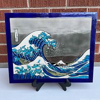 Front view of cloisonné tile art on stand