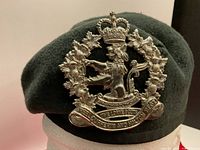 Front view of beret showing cap badge details