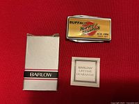 Money clip front with box and guarantee card