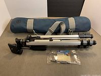 Tripod folded with carry bag and lens pen