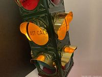 close-up of amber lens marked LAST CALL with gold visor