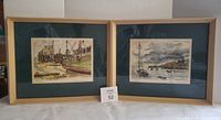 Both framed lithographs side by side with lot card