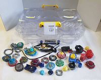 Group shot of battle stadium, tops, launchers and parts