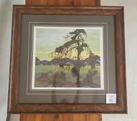 Full view of framed print under glass showing artwork and frame