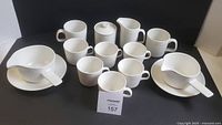 Full set showing cups, mugs, creamer, sugar bowl, gravy boats with underplates