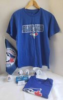 All items grouped: shirts, flag, baseballs, card decks, mug
