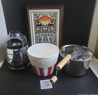 All four items grouped: air popper, Whirley popper, ceramic bowl, framed cross-stitch