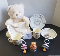 Group shot of plush bear, dishware and trinket boxes