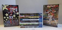 Front covers of Harley Quinn Vols 1-2 and spine stack of remaining books