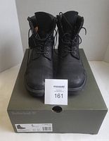 Front view of both boots on original box with lot tag visible