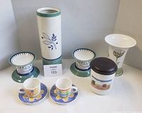 Group shot of all Villeroy & Boch items including vases, candle holders, cups, saucers, jar