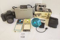 Group shot of all cameras, flash, bulbs, case