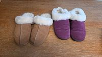 Top view of two pairs of women's size 8 slippers: tan UGG slippers and berry Cloud Nine slippers placed side by side on wood surface.