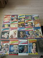 Full layout of 22 Outlanders manga comic books by Johji Manabe on floor.