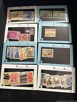 First image showing nine Chinese used stamps on album pages, including cultural scenes, calligraphy labels, and historic monuments.