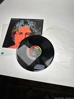 John Lennon Menlove Avenue vinyl record with album cover and white inner sleeve laid out flat.