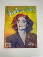 Full front cover of Interview Magazine October 1987 with Kelly McGillis, showing colorful stylized portrait and title.