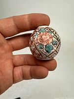 Porcelain bead with hand-painted peach flower and leaves, detailed floral design
