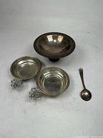 Group shot of all four metal items showing different types of dishes and spoon