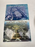Photo of the two hardcover photography books titled 'Above Paris' and 'Above London' showing aerial views of the respective cities on their covers.