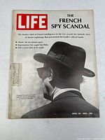 Front cover of the Life magazine showing black and white photo of man and headline about French spy scandal.