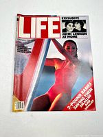 Front cover of Life magazine February 1981 featuring a woman in red swimwear and headline about John Lennon at home.