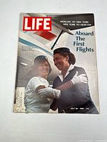 Front cover of the Life magazine depicting two flight attendants with text 'Aboard The First Flights'