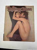 Front cover showing John Lennon and Yoko Ono in an intimate pose, color photo, some wear on edges.