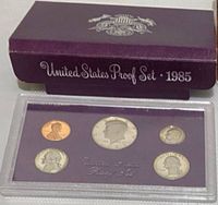 Outer purple box marked United States Proof Set 1985 with sealed holder visible