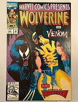 Front cover showing Wolverine and Venom artwork, issue number and price