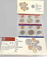 Envelope, insert card and both sealed cellophane coin packs displayed