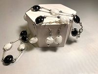 Necklace section draped with earrings displayed