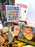 Assortment of poster prints and stamp sheet