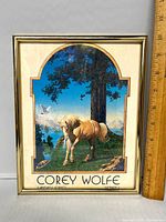 Front view of framed Corey Wolfe unicorn print
