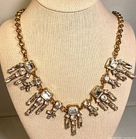 Front view of necklace on display form showcasing design and crystals