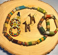 Necklace, bracelet, both earring pairs displayed