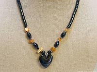Close-up of hematite heart pendant and surrounding beads