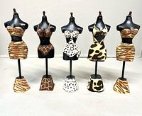 Front view of all five animal-print mini mannequins