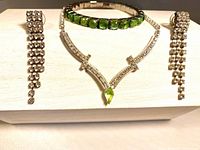 Full set: necklace, bracelet, earrings displayed