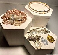 Overview of lot showing all jewelry pieces on display blocks