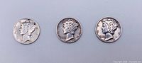 Obverse view of three Mercury dimes