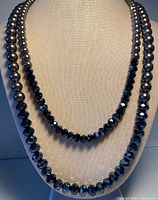 Necklace on display bust showing both strands and bead types