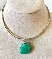 Full view of choker necklace with pendant on display bust