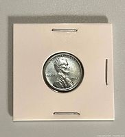 Obverse of 1943-D steel cent in holder