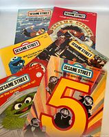 Front covers of six Sesame Street Magazines displayed fan-style